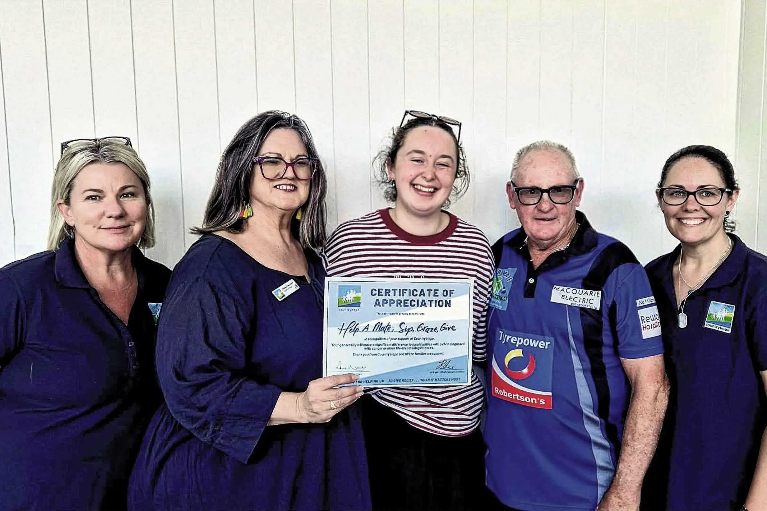 <p>Mandy Kelly, Donna Falconer, Abby Ryan and Mick O\\'Neill (Help A Mate), and Erin Driscoll. Photo: Supplied</p>\\n