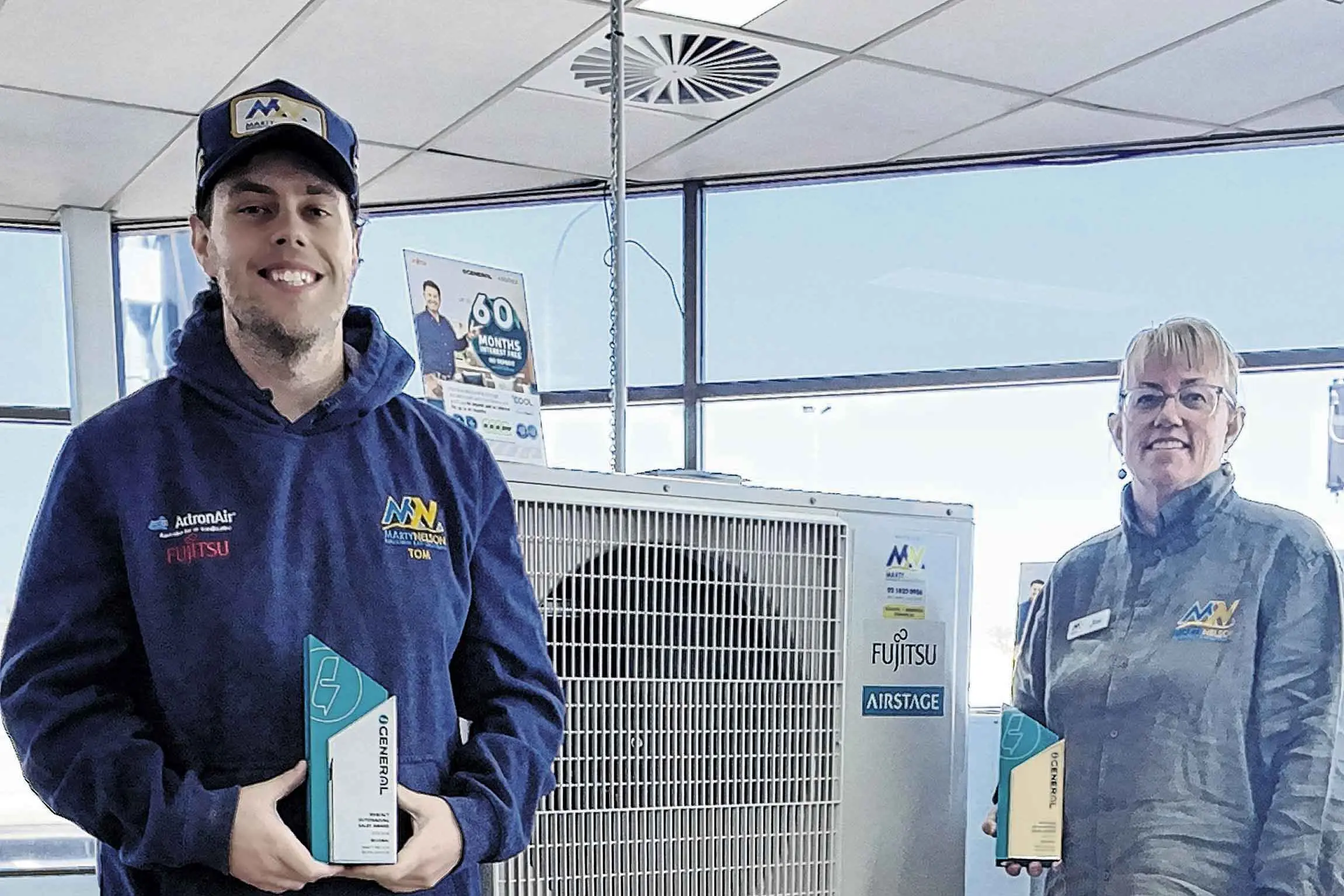 <p>Thomas Nelson and his aunt, Jane Thompson, who also works at Marty Nelson Refrigeration and Air Conditioning, with their awards from Munich. Photo: Dubbo Photo News</p>\\n