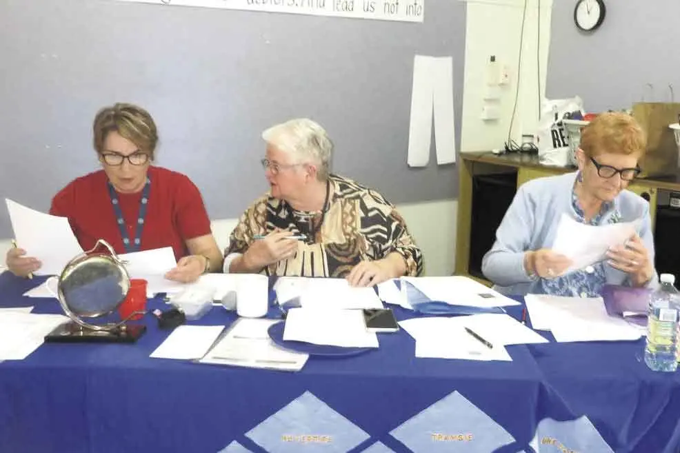 <p>CWA Far Western Group Executive Stephanie Van Lubeck (Warren CWA), Jeni Milligan (Nyngan CWA), Pauline Serdity (Warren CWA) prepare for the AGM on October 10. Photo: Pat Riley</p>\\n