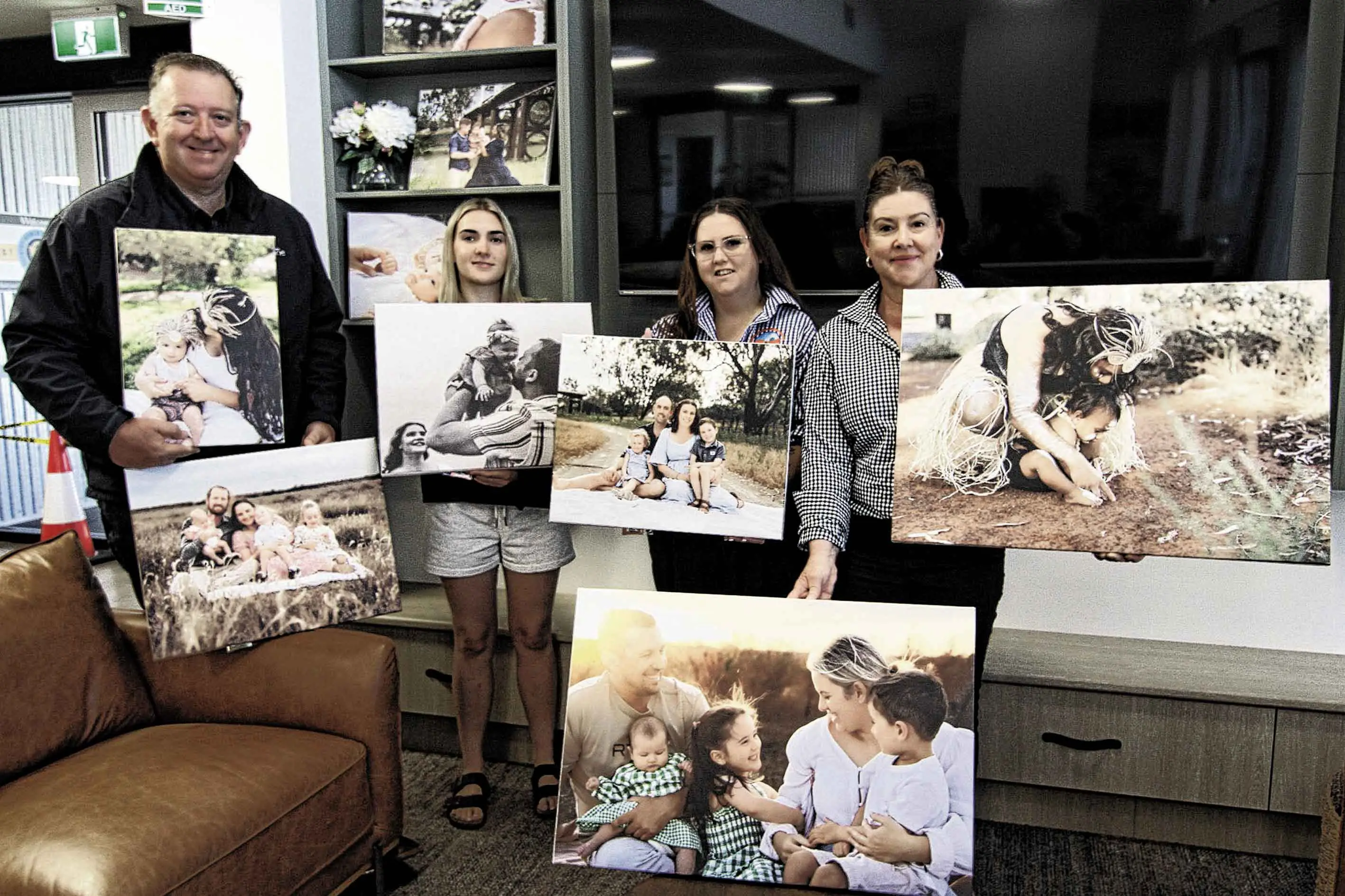 <p>Rod Crowfoot (Managing Director Macquarie Home Stay) with Emily Bowden (Connected Beginnings Community Facilitator), Abbey Warwick (Aboriginal Liaison Officer) and Belinda Cunningham (Connected Beginnings Community Facilitator) proudly showcasing the selection of images of families who feature in the project. Photo: Supplied</p>\\n